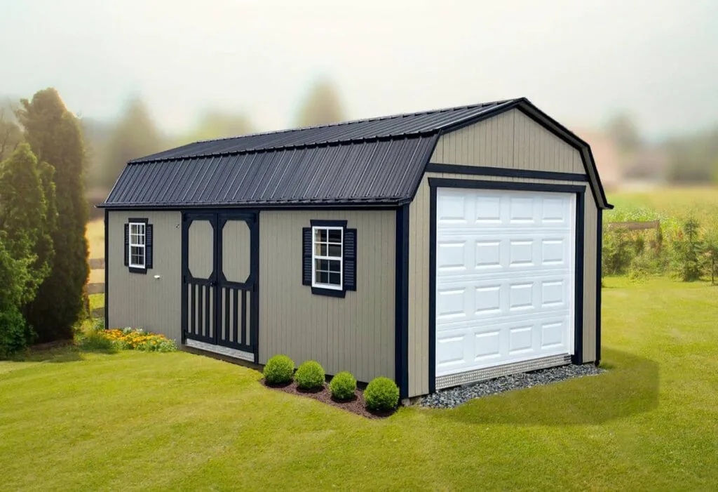 Beige Elite Lofted Garden Barn with black trim, side double doors, windows, and white garage door on a grassy lot