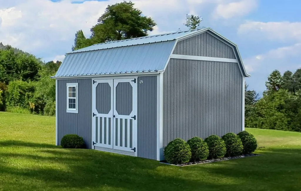 Light gray Elite Lofted Garden Barn with white trim and double doors on a grassy lot